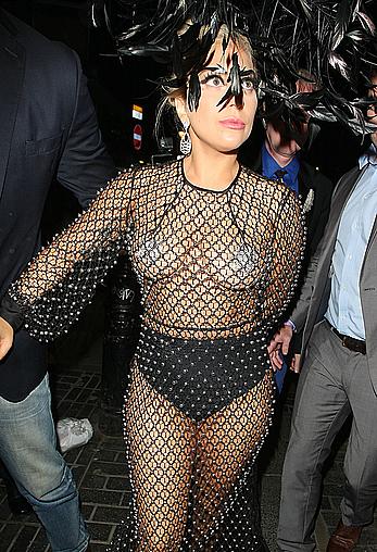 Lady Gaga topless with pasties under fishnet dress in London