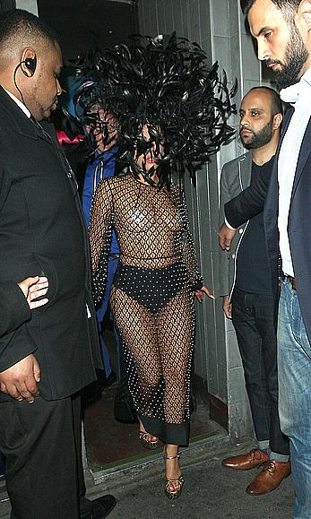 Lady Gaga topless with pasties under fishnet dress in London