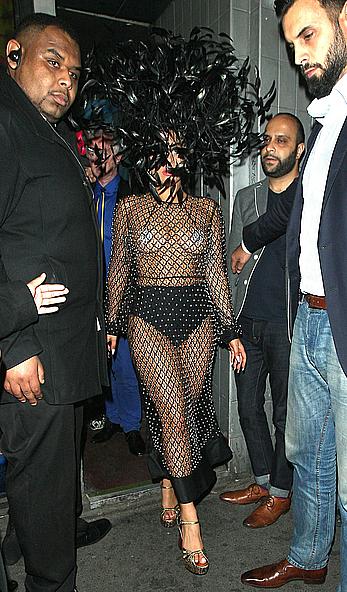 Lady Gaga topless with pasties under fishnet dress in London