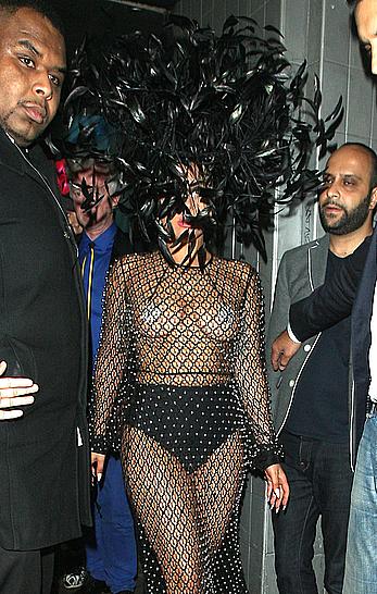 Lady Gaga topless with pasties under fishnet dress in London