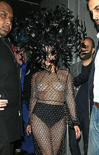 Lady Gaga topless with pasties under fishnet dress in London