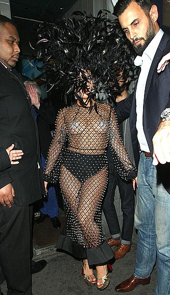 Lady Gaga topless with pasties under fishnet dress in London