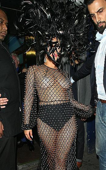 Lady Gaga topless with pasties under fishnet dress in London