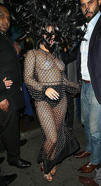 Lady Gaga topless with pasties under fishnet dress in London