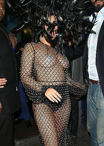 Lady Gaga topless with pasties under fishnet dress in London