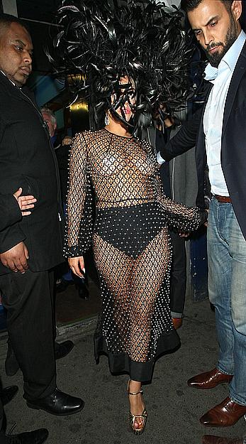 Lady Gaga topless with pasties under fishnet dress in London