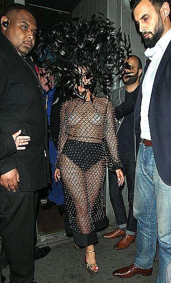 Lady Gaga topless with pasties under fishnet dress in London