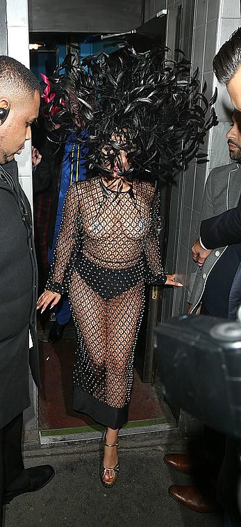 Lady Gaga topless with pasties under fishnet dress in London