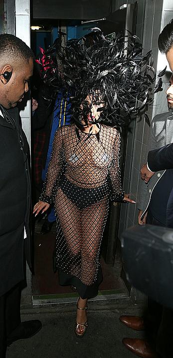 Lady Gaga topless with pasties under fishnet dress in London