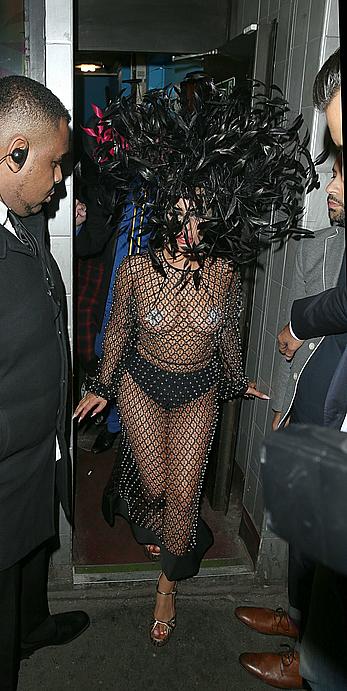 Lady Gaga topless with pasties under fishnet dress in London