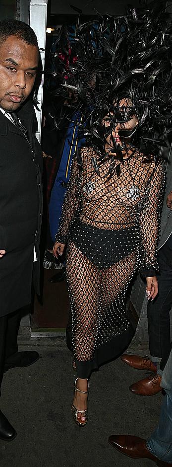 Lady Gaga topless with pasties under fishnet dress in London