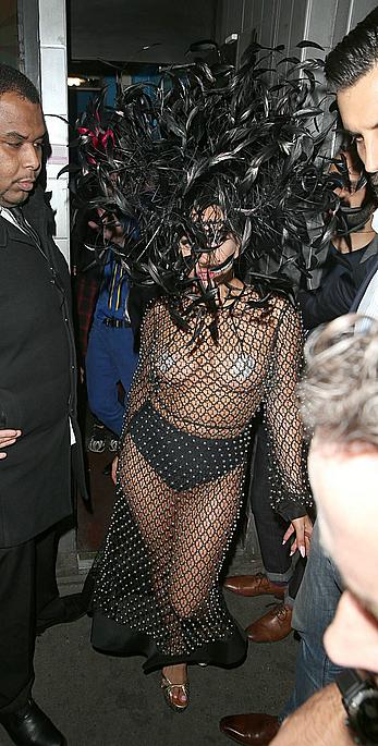 Lady Gaga topless with pasties under fishnet dress in London