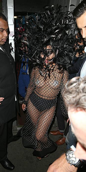 Lady Gaga topless with pasties under fishnet dress in London