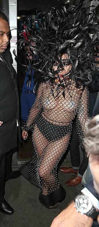 Lady Gaga topless with pasties under fishnet dress in London