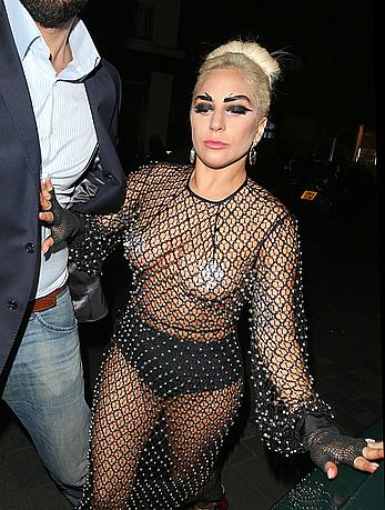 Lady Gaga topless with pasties under fishnet dress in London