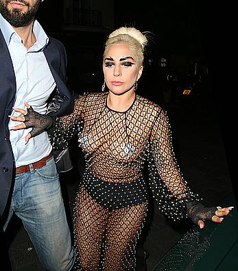 Lady Gaga topless with pasties under fishnet dress in London