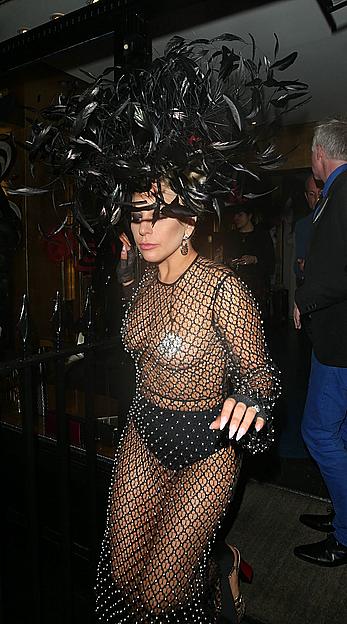 Lady Gaga topless with pasties under fishnet dress in London