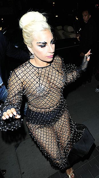 Lady Gaga topless with pasties under fishnet dress in London