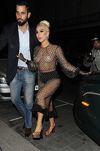 Lady Gaga topless with pasties under fishnet dress in London