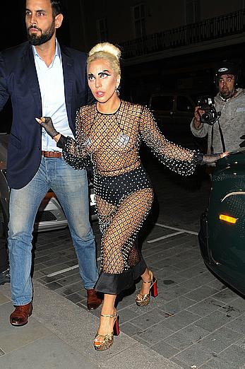 Lady Gaga topless with pasties under fishnet dress in London