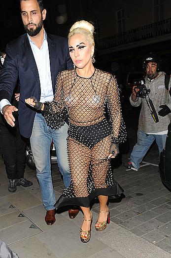 Lady Gaga topless with pasties under fishnet dress in London