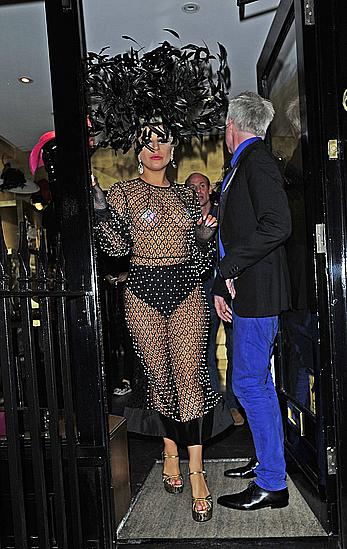 Lady Gaga topless with pasties under fishnet dress in London