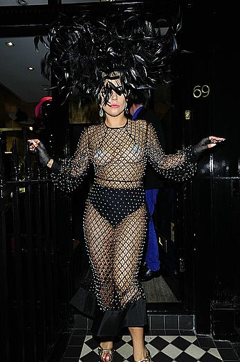 Lady Gaga topless with pasties under fishnet dress in London