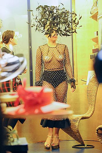 Lady Gaga topless with pasties under fishnet dress in London