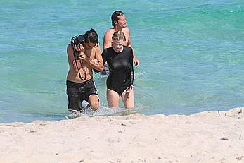 Lara Stone seen topless during a swimwear photoset on Miami Beach