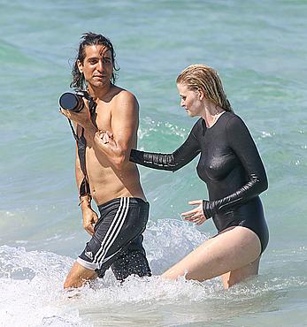 Lara Stone seen topless during a swimwear photoset on Miami Beach