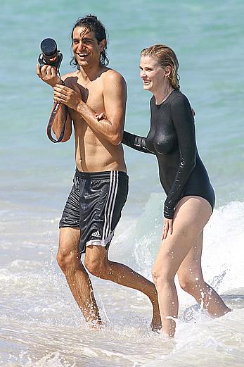 Lara Stone seen topless during a swimwear photoset on Miami Beach