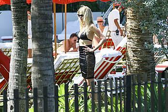 Lara Stone seen topless during a swimwear photoset on Miami Beach