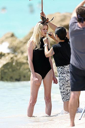 Lara Stone seen topless during a swimwear photoset on Miami Beach