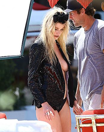 Lara Stone seen topless during a swimwear photoset on Miami Beach