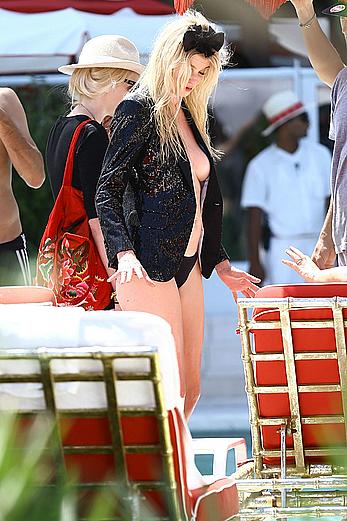 Lara Stone seen topless during a swimwear photoset on Miami Beach