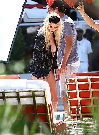 Lara Stone seen topless during a swimwear photoset on Miami Beach