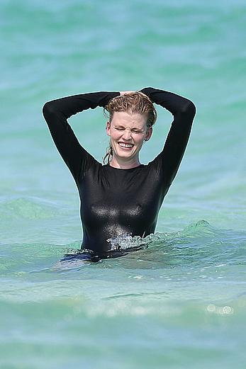 Lara Stone seen topless during a swimwear photoset on Miami Beach