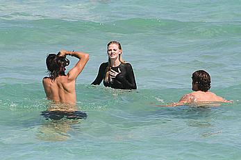 Lara Stone seen topless during a swimwear photoset on Miami Beach