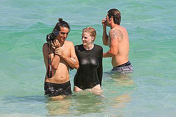 Lara Stone seen topless during a swimwear photoset on Miami Beach