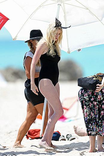 Lara Stone seen topless during a swimwear photoset on Miami Beach