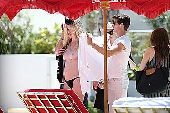 Lara Stone seen topless during a swimwear photoset on Miami Beach