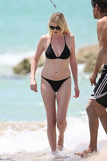 Lara Stone seen topless during a swimwear photoset on Miami Beach