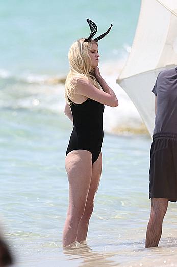 Lara Stone seen topless during a swimwear photoset on Miami Beach