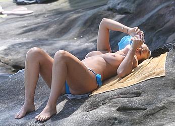 Lara Bingle sunbathing topless in Sydney