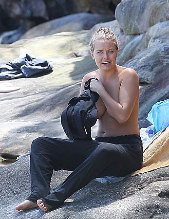 Lara Bingle sunbathing topless in Sydney