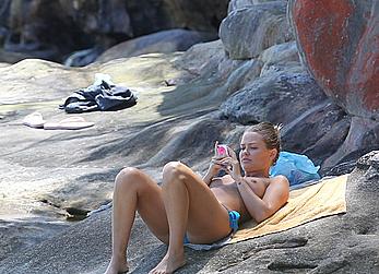 Lara Bingle sunbathing topless in Sydney