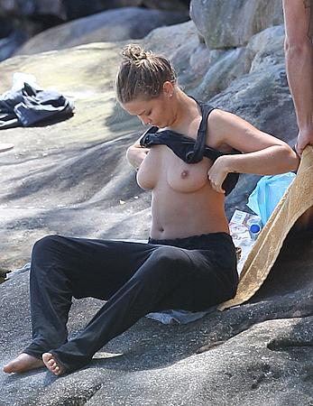 Lara Bingle sunbathing topless in Sydney