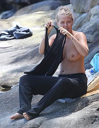 Lara Bingle sunbathing topless in Sydney