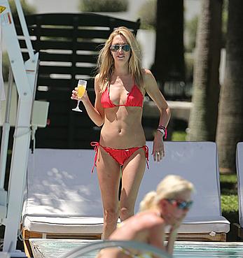 Lauren Stoner in red bikini poolside in Miami