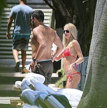 Lauren Stoner in red bikini poolside in Miami